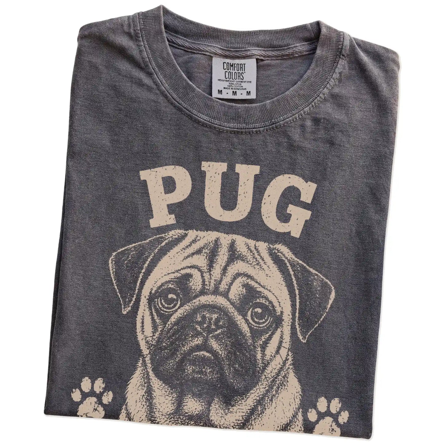 Folded Pepper Comfort Colors® T-shirt showing Pug design with “Snore Loud, Love Hard” lettering