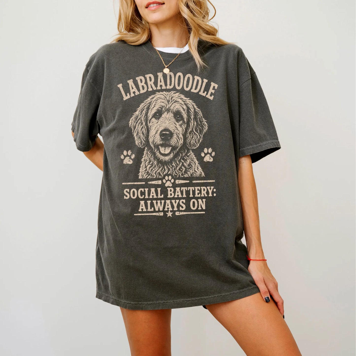 Model wearing a Pepper Comfort Colors® T-shirt featuring Labradoodle design with “Social Battery” lettering