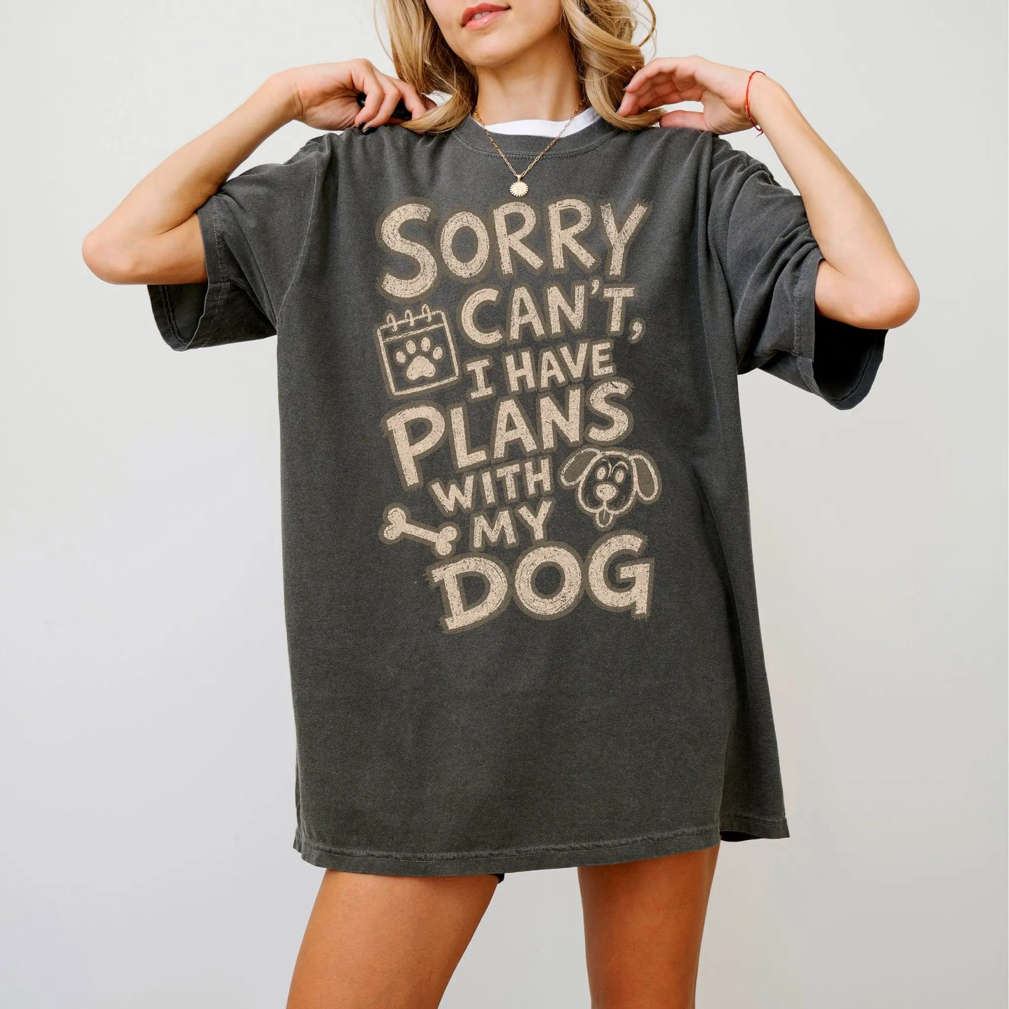 Model wearing a Pepper Comfort Colors® T-shirt with sorry can't i have plans with my dog lettering