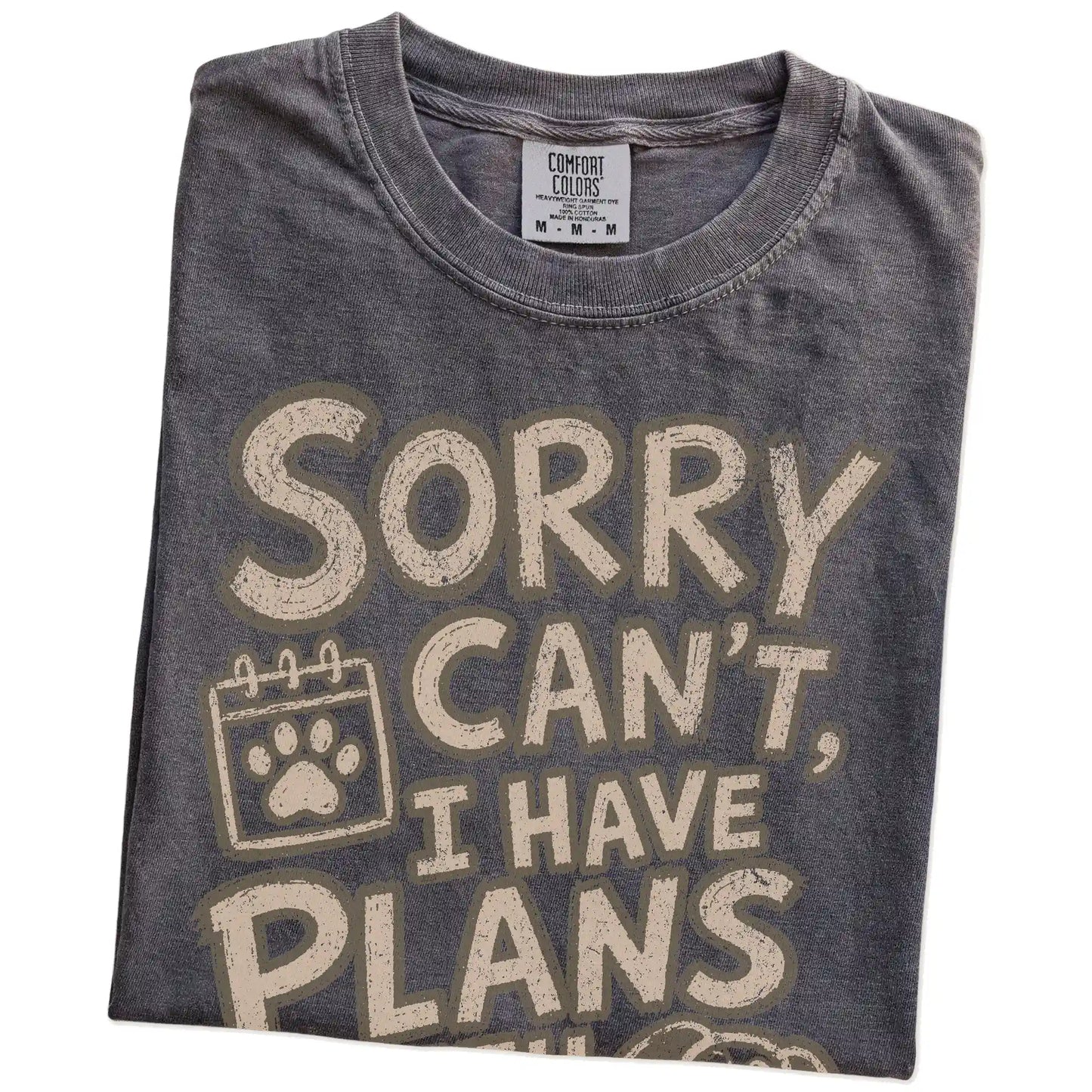 Folded Pepper Comfort Colors® T-shirt showing sorry can't i have plans with my dog lettering