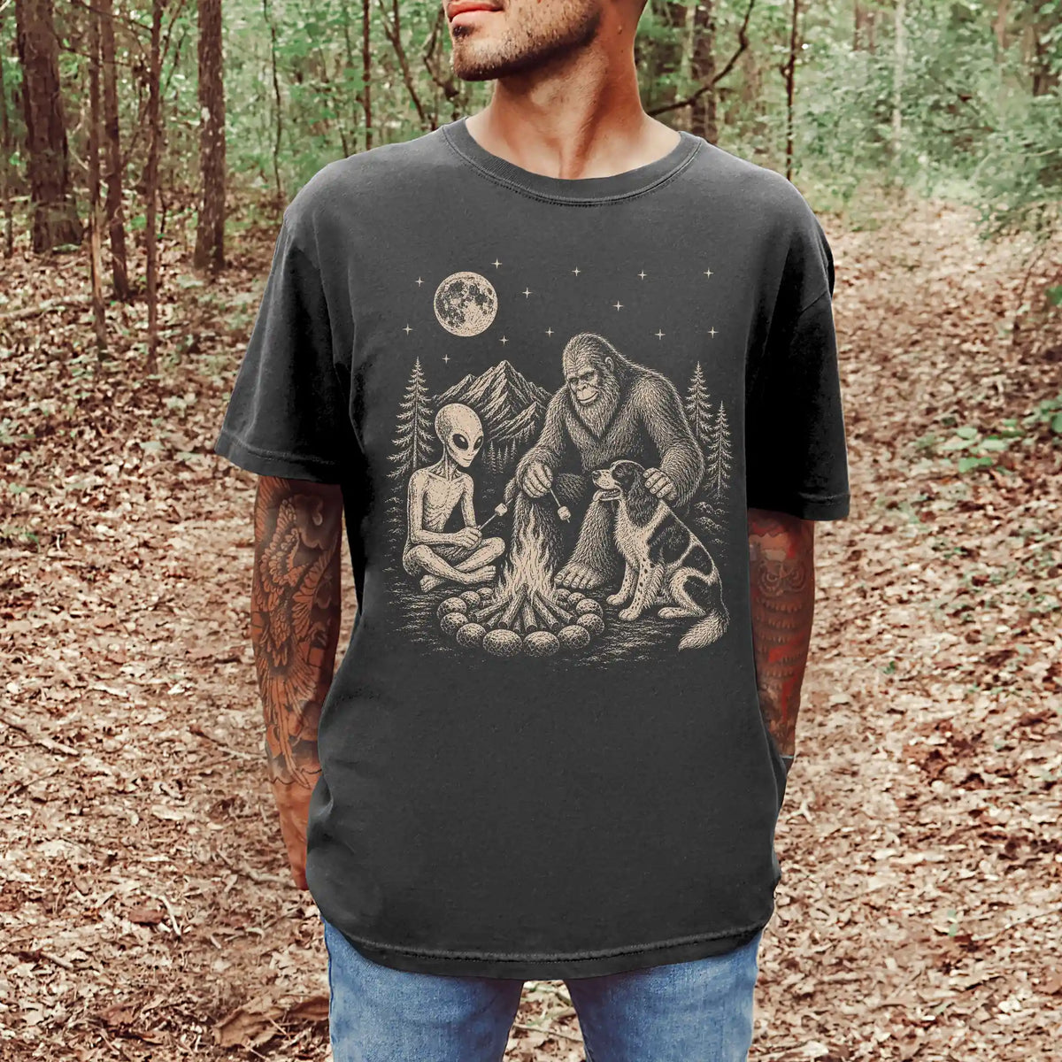 Model wearing a Pepper Comfort Colors® T-shirt showing Springer Spaniel camping with Bigfoot and an alien