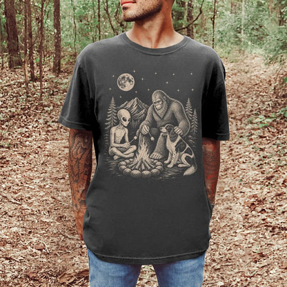 Model wearing a Pepper Comfort Colors® T-shirt showing Springer Spaniel camping with Bigfoot and an alien