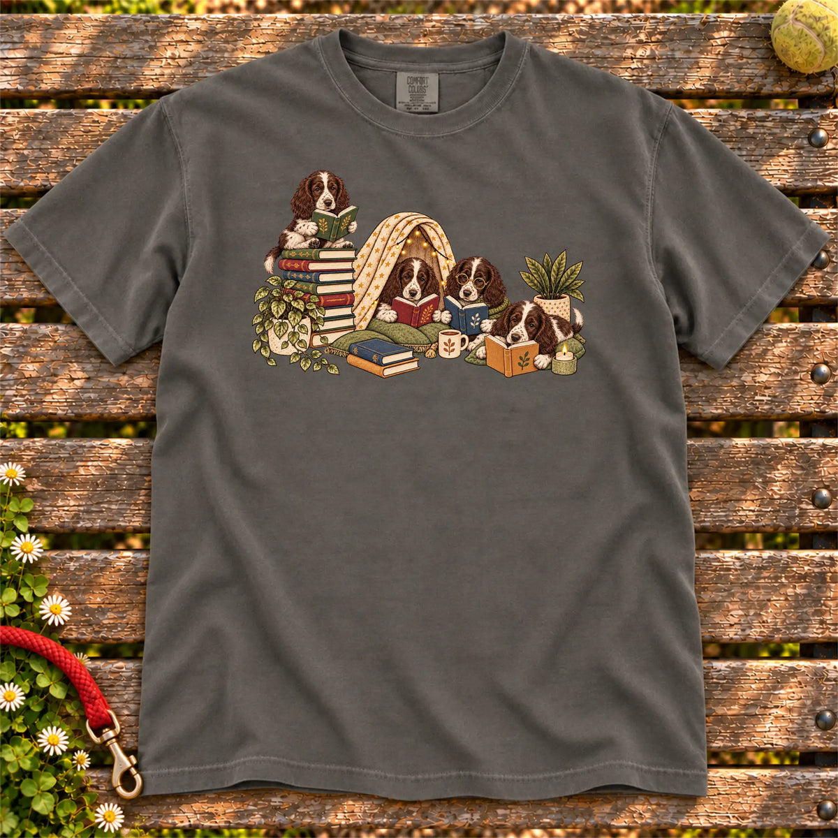 Springer Spaniel puppies reading books in a cozy blanket fort on a Pepper T-shirt