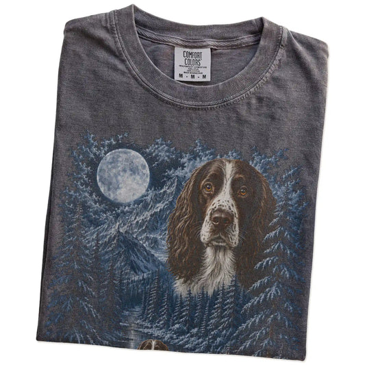 Folded pepper T-shirt with Springer Spaniel Winter Moon artwork.