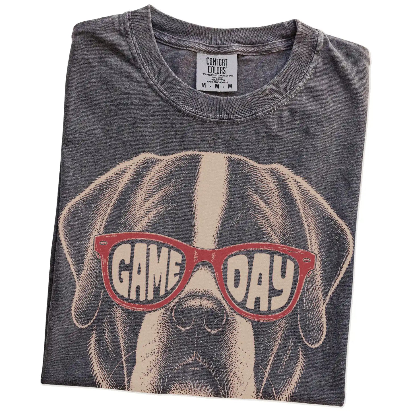 Folded Pepper Comfort Colors® T-shirt showing saint bernard wearing red game day sunglasses