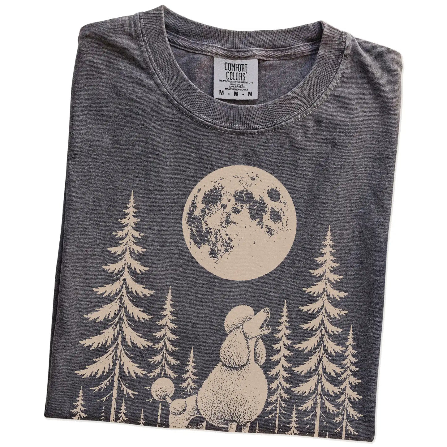 Folded Pepper Comfort Colors® T-shirt showing a Standard Poodle howling beneath the moon and pine trees