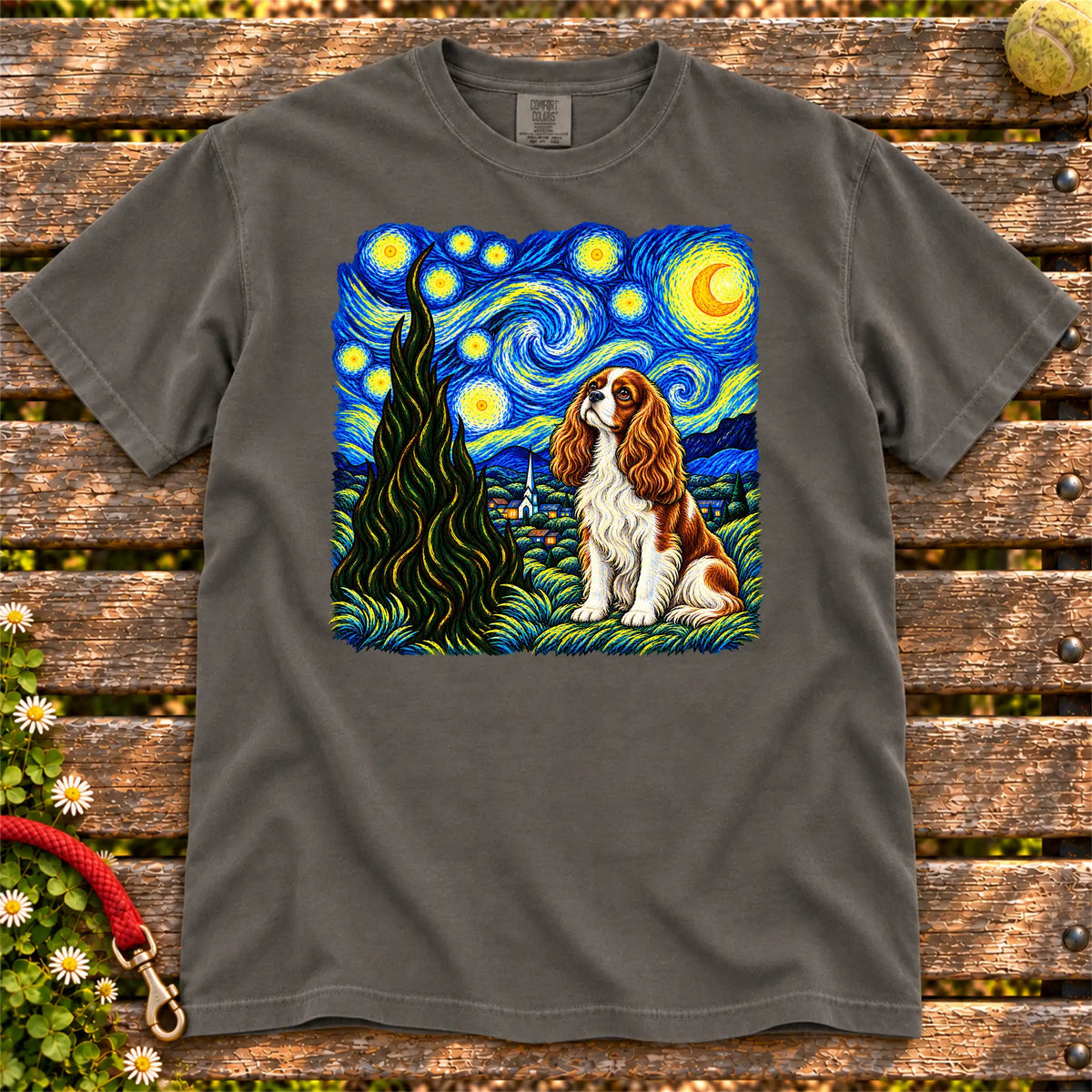 Colorful Cavalier King Charles Spaniel beneath a swirling starry night sky on a Pepper T-shirt