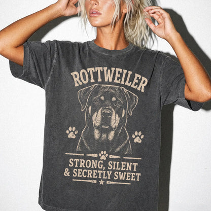 Model wearing a Pepper Comfort Colors® T-shirt featuring Rottweiler design with “Strong, Silent & Secretly Sweet” lettering