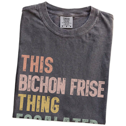 Folded Pepper Comfort Colors® T-shirt showing retro “This Bichon Frise Thing Escalated Quickly” lettering