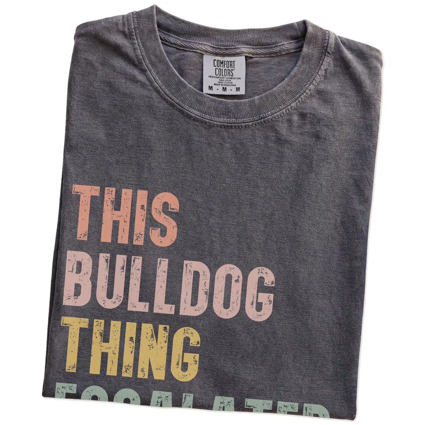 Folded Pepper Comfort Colors® T-shirt showing retro “This Bulldog Thing Escalated Quickly” lettering