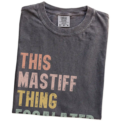 Folded Pepper Comfort Colors® T-shirt showing retro “This Mastiff Thing Escalated Quickly” lettering