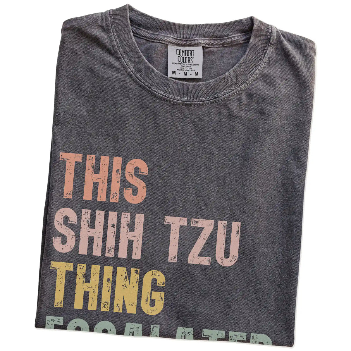 Folded Pepper Comfort Colors® T-shirt showing retro “This Shih Tzu Thing Escalated Quickly” lettering
