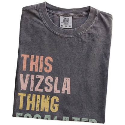 Folded Pepper Comfort Colors® T-shirt showing retro “This Vizsla Thing Escalated Quickly” lettering