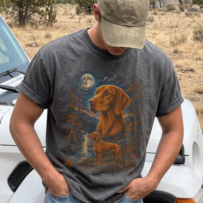 Model wearing a pepper T-shirt with Vizsla Autumn Moon artwork.