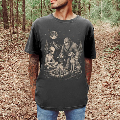 Model wearing a Pepper Comfort Colors® T-shirt showing Vizsla camping with Bigfoot and an alien