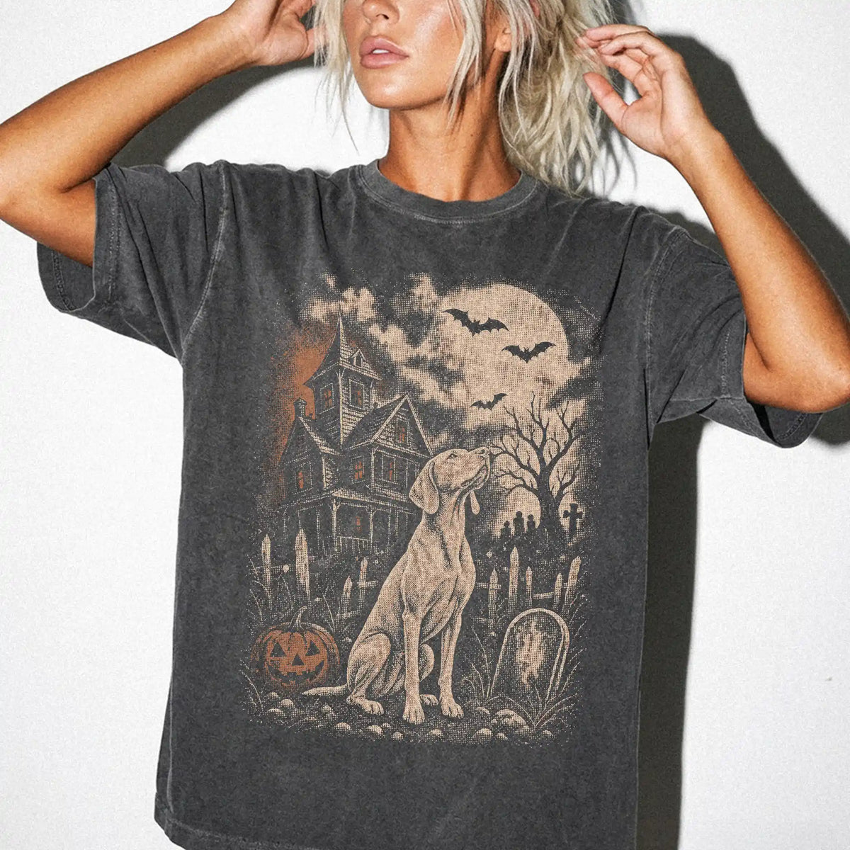 Model wearing a Pepper Comfort Colors® T-shirt showing Vizsla in a vintage haunted-house scene