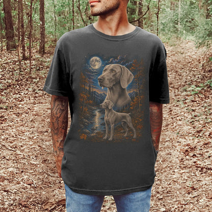 Model wearing a pepper T-shirt with Weimaraner Autumn Moon artwork.