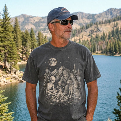 Model wearing a Pepper Comfort Colors® T-shirt showing Weimaraner camping with Bigfoot and an alien