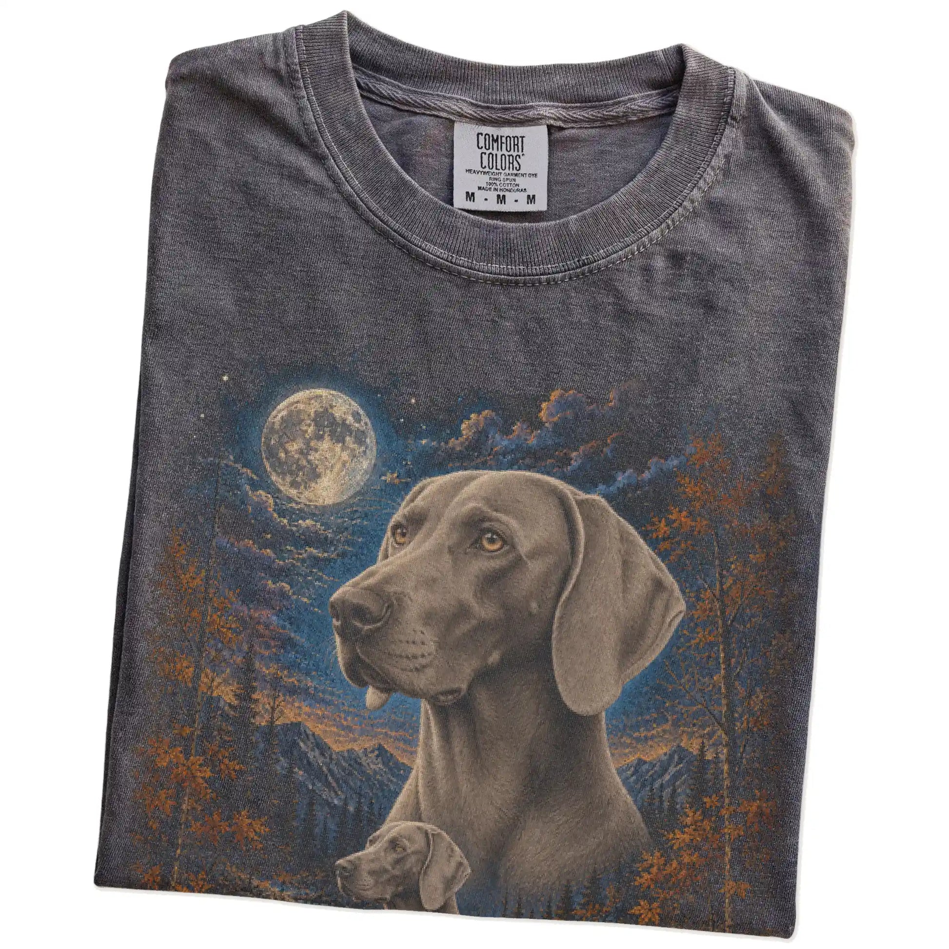 Folded Pepper Comfort Colors® t-shirt showing Weimaraner in a fall forest graphic
