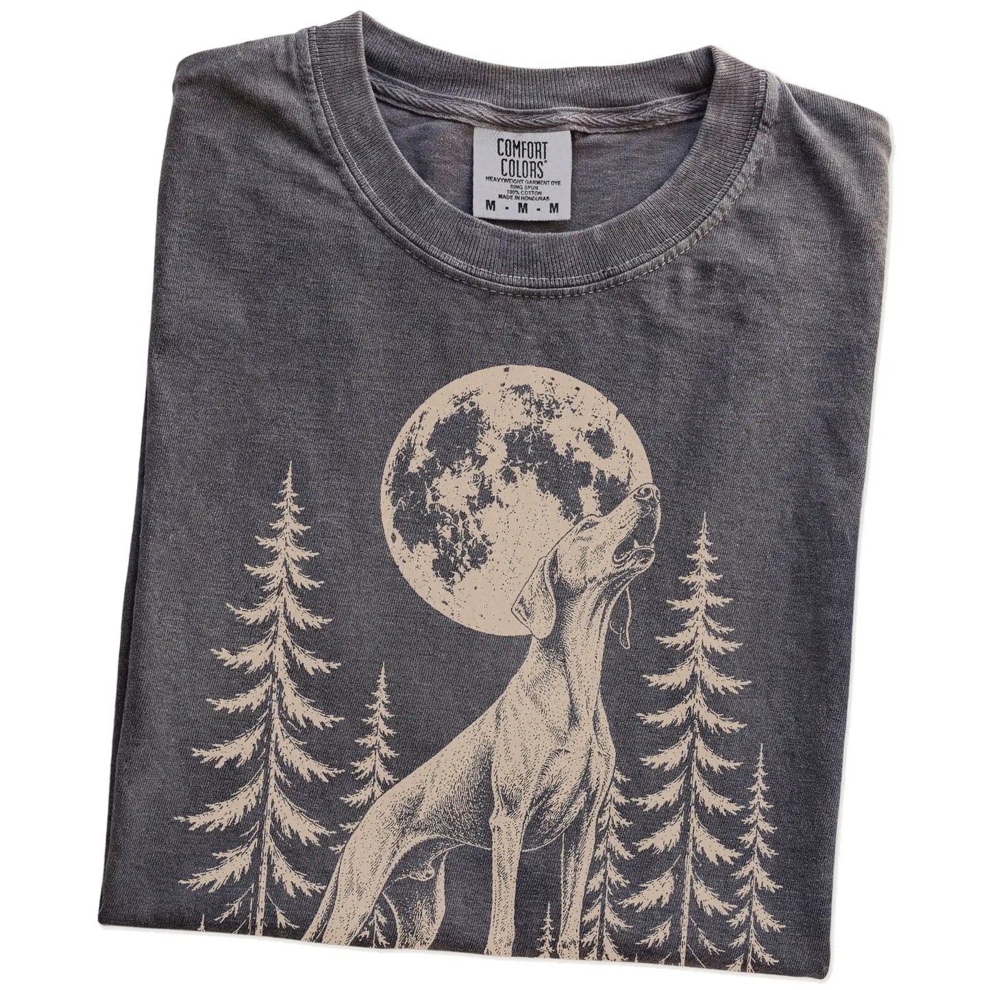 Folded Pepper Comfort Colors® T-shirt showing a Weimaraner howling beneath the moon and pine trees