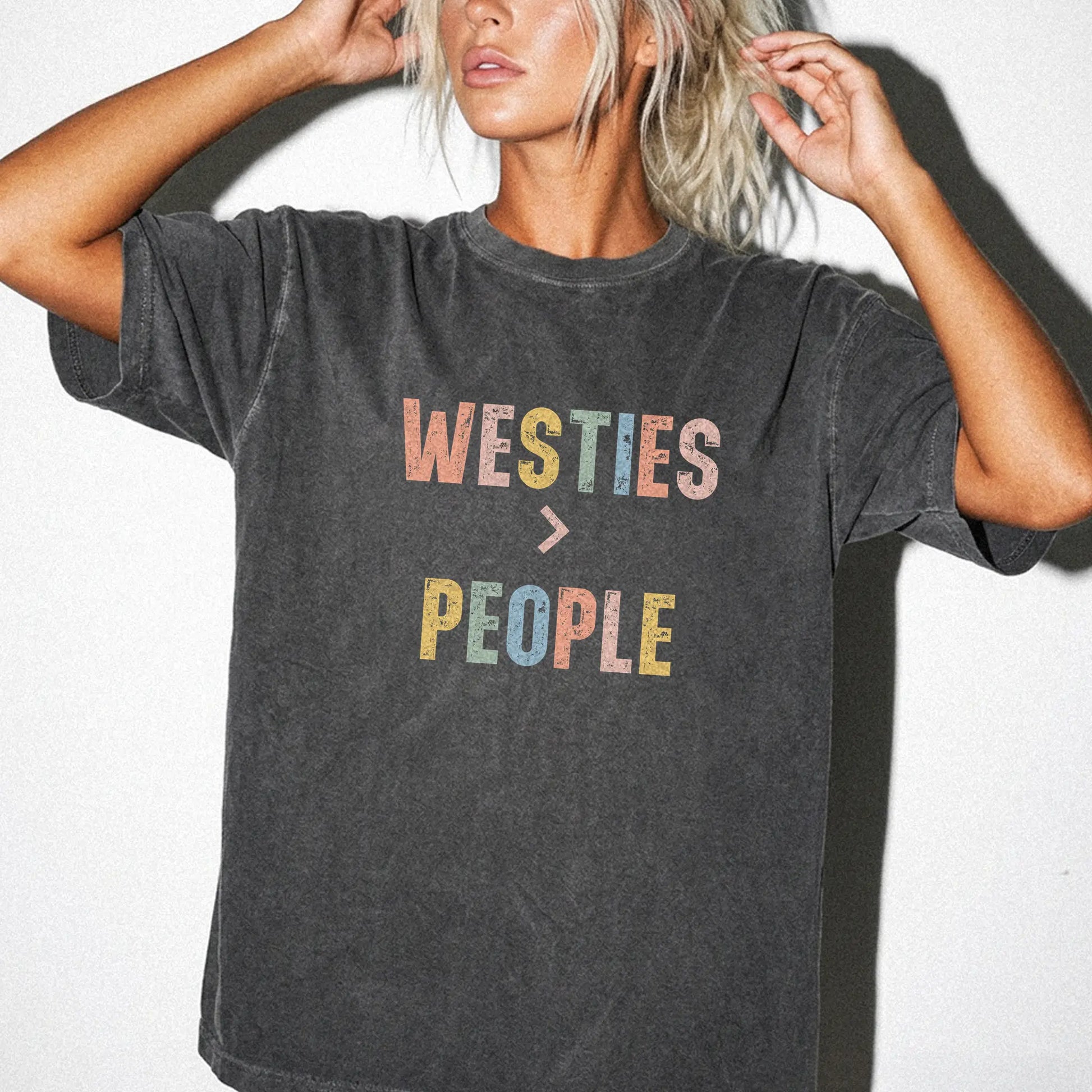 Model wearing a Pepper Comfort Colors® T-shirt with “Westies > People” text