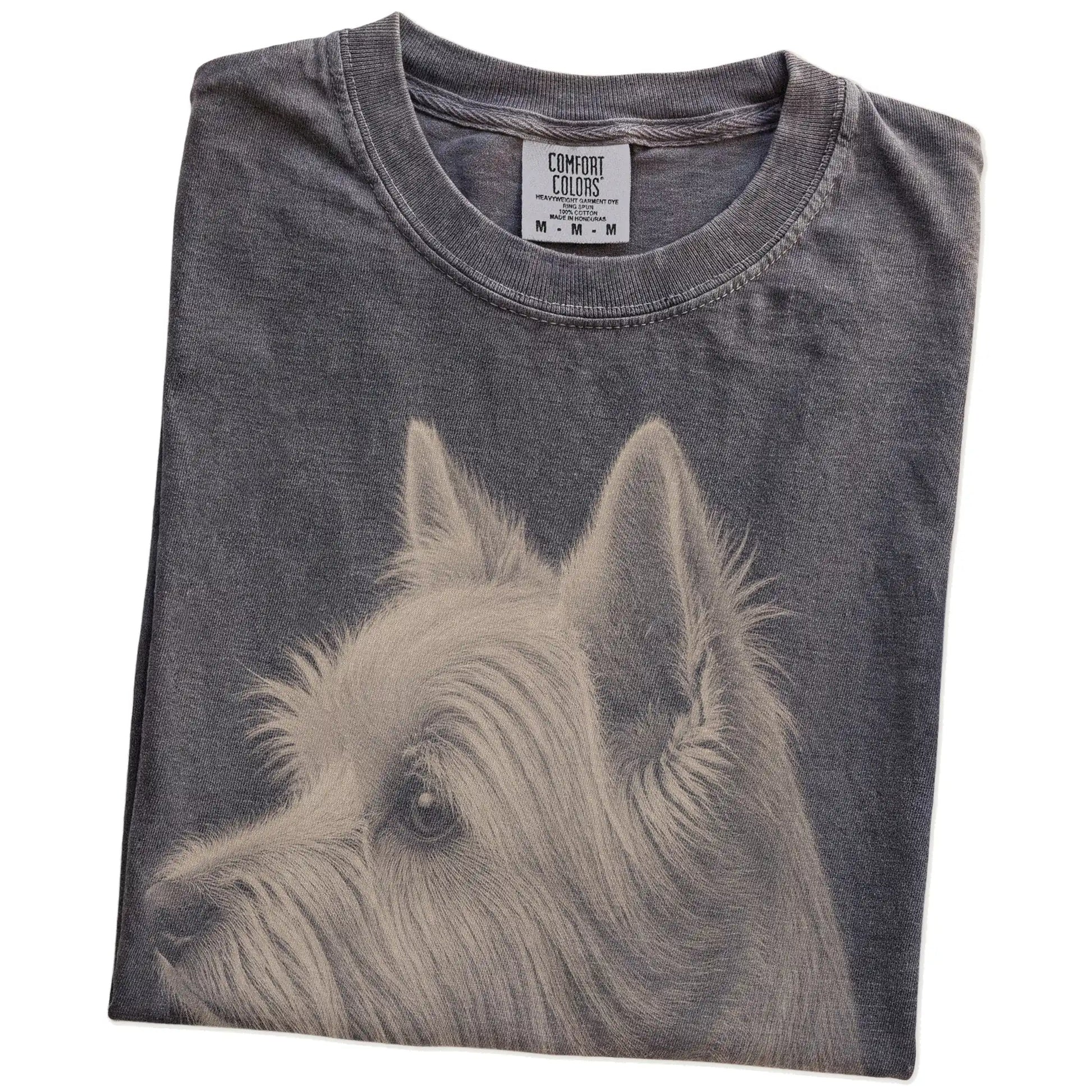 Folded Pepper Comfort Colors® T-shirt showing a detailed photographic portrait of a Westie