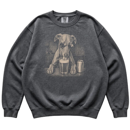 Pepper Whippet drinking from a pint at a bar, laid flat