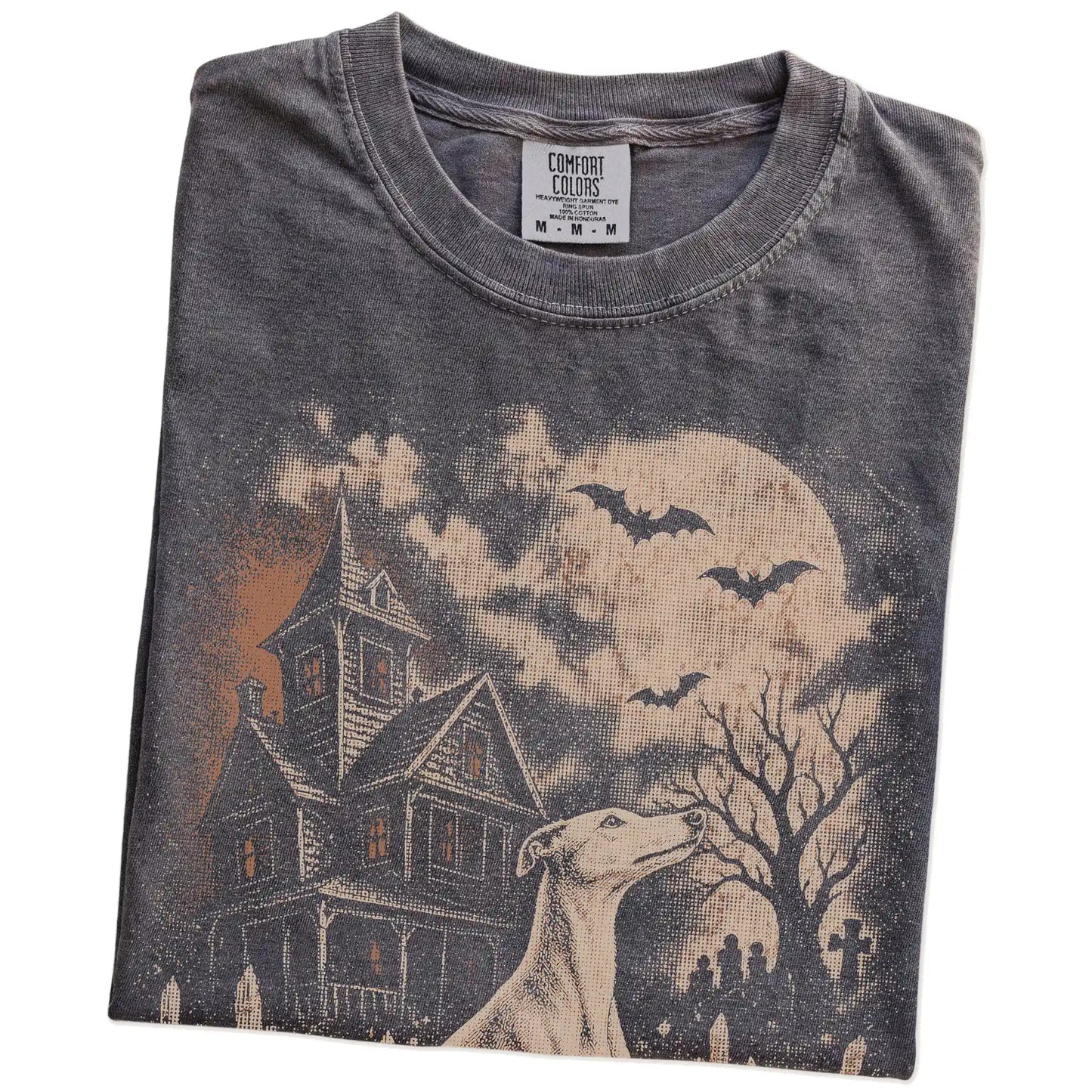 Folded Pepper Comfort Colors® T-shirt showing Whippet in a vintage haunted-house scene