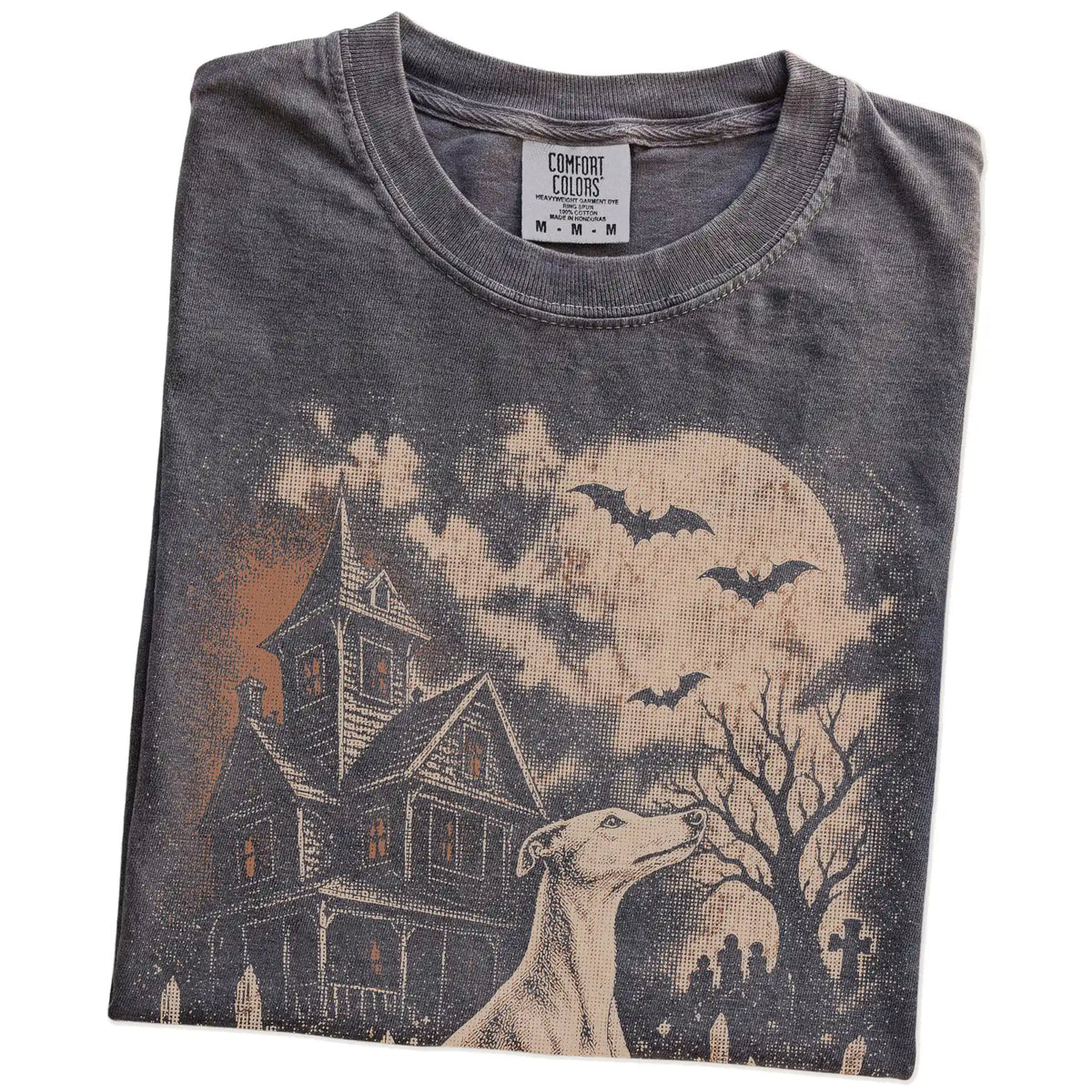 Folded Pepper Comfort Colors® T-shirt showing Whippet in a vintage haunted-house scene