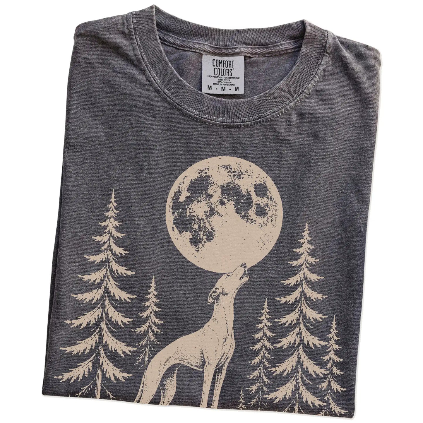 Folded Pepper Comfort Colors® T-shirt showing a Whippet howling beneath the moon and pine trees