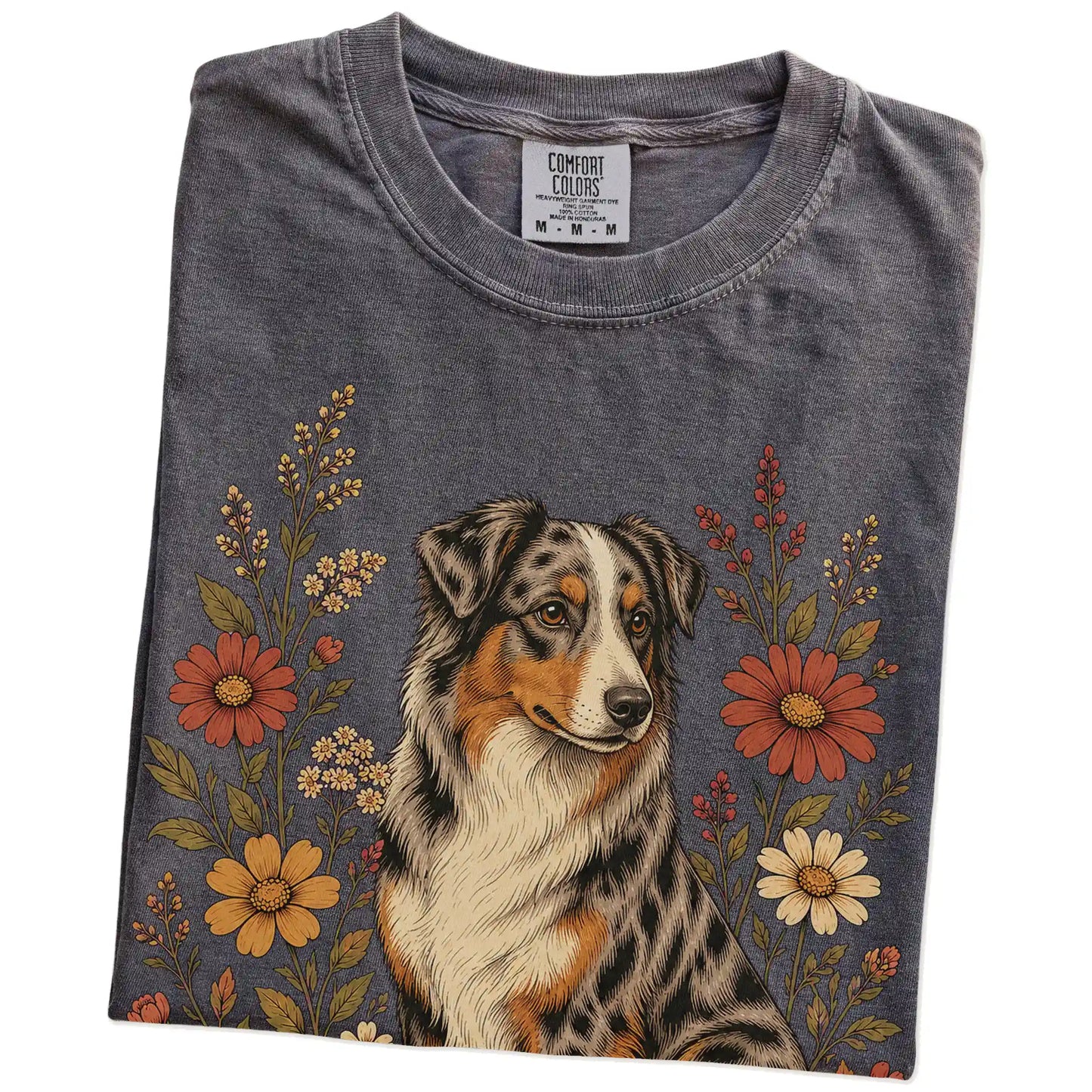 Folded Pepper Comfort Colors® T-shirt showing Australian Shepherd portrait surrounded by wildflowers beneath the moon