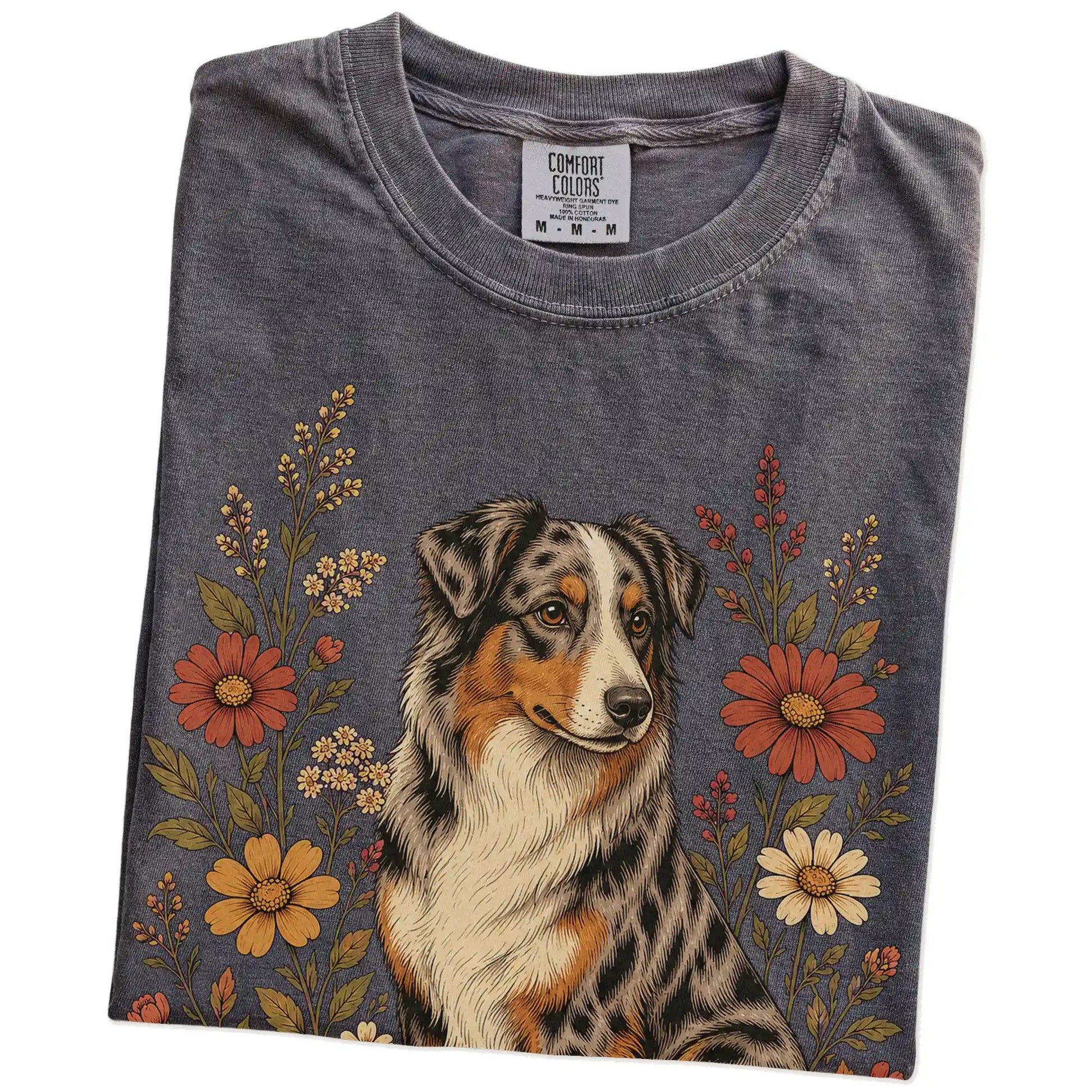 Folded Pepper Comfort Colors® T-shirt showing Australian Shepherd portrait surrounded by wildflowers beneath the moon