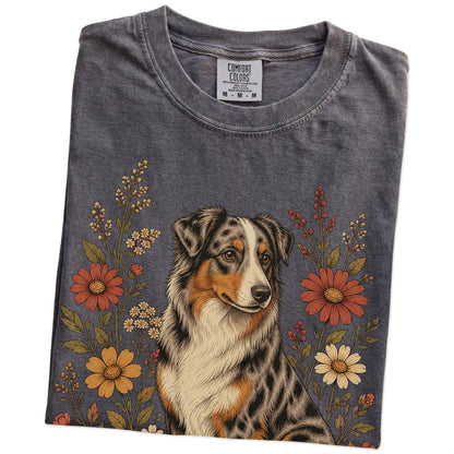 Folded Pepper Comfort Colors® T-shirt showing Australian Shepherd portrait surrounded by wildflowers beneath the moon