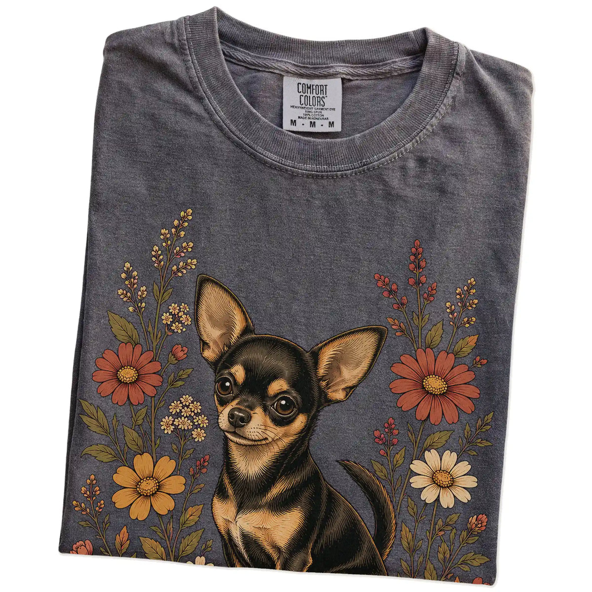 Folded Pepper Comfort Colors® T-shirt showing Chihuahua portrait surrounded by wildflowers beneath the moon