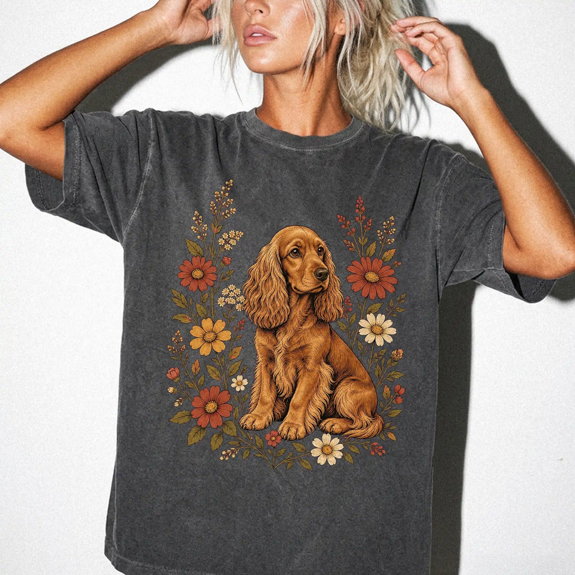Model wearing a Pepper Comfort Colors® T-shirt showing Cocker Spaniel portrait surrounded by wildflowers beneath the moon