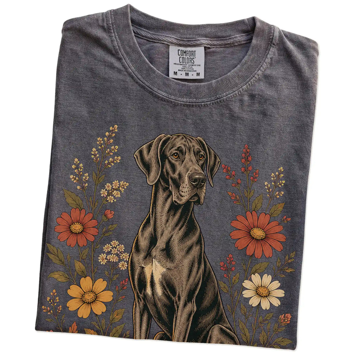 Folded Pepper Comfort Colors® T-shirt showing Great Dane portrait surrounded by wildflowers beneath the moon
