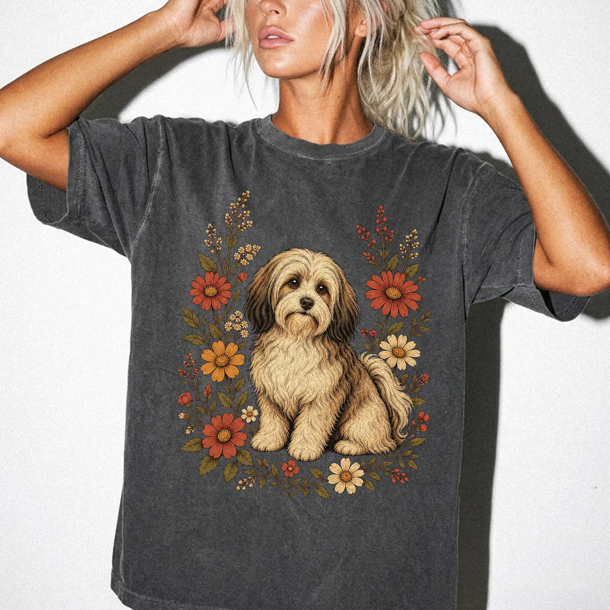 Model wearing a Pepper Comfort Colors® T-shirt showing Havanese portrait surrounded by wildflowers beneath the moon