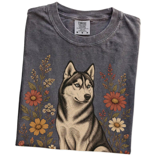 Folded Pepper Comfort Colors® T-shirt showing Husky portrait surrounded by wildflowers beneath the moon