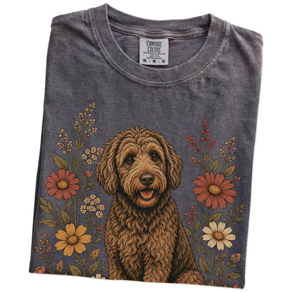 Folded Pepper Comfort Colors® T-shirt showing Labradoodle portrait surrounded by wildflowers beneath the moon