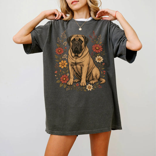 Model wearing a Pepper Comfort Colors® T-shirt showing Mastiff portrait surrounded by wildflowers beneath the moon