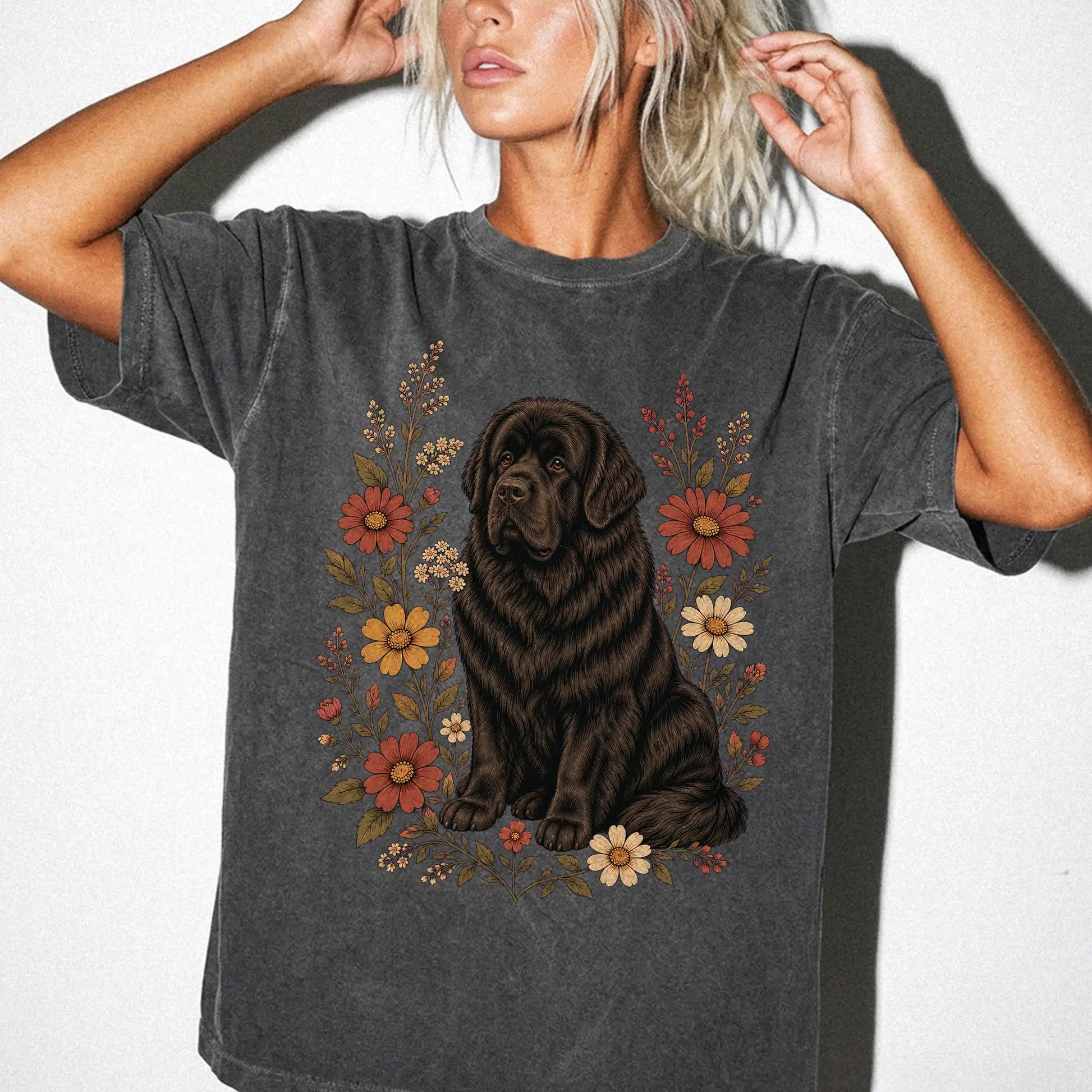 Model wearing a Pepper Comfort Colors® T-shirt showing Newfie portrait surrounded by wildflowers beneath the moon