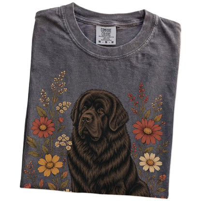 Folded Pepper Comfort Colors® T-shirt showing Newfie portrait surrounded by wildflowers beneath the moon