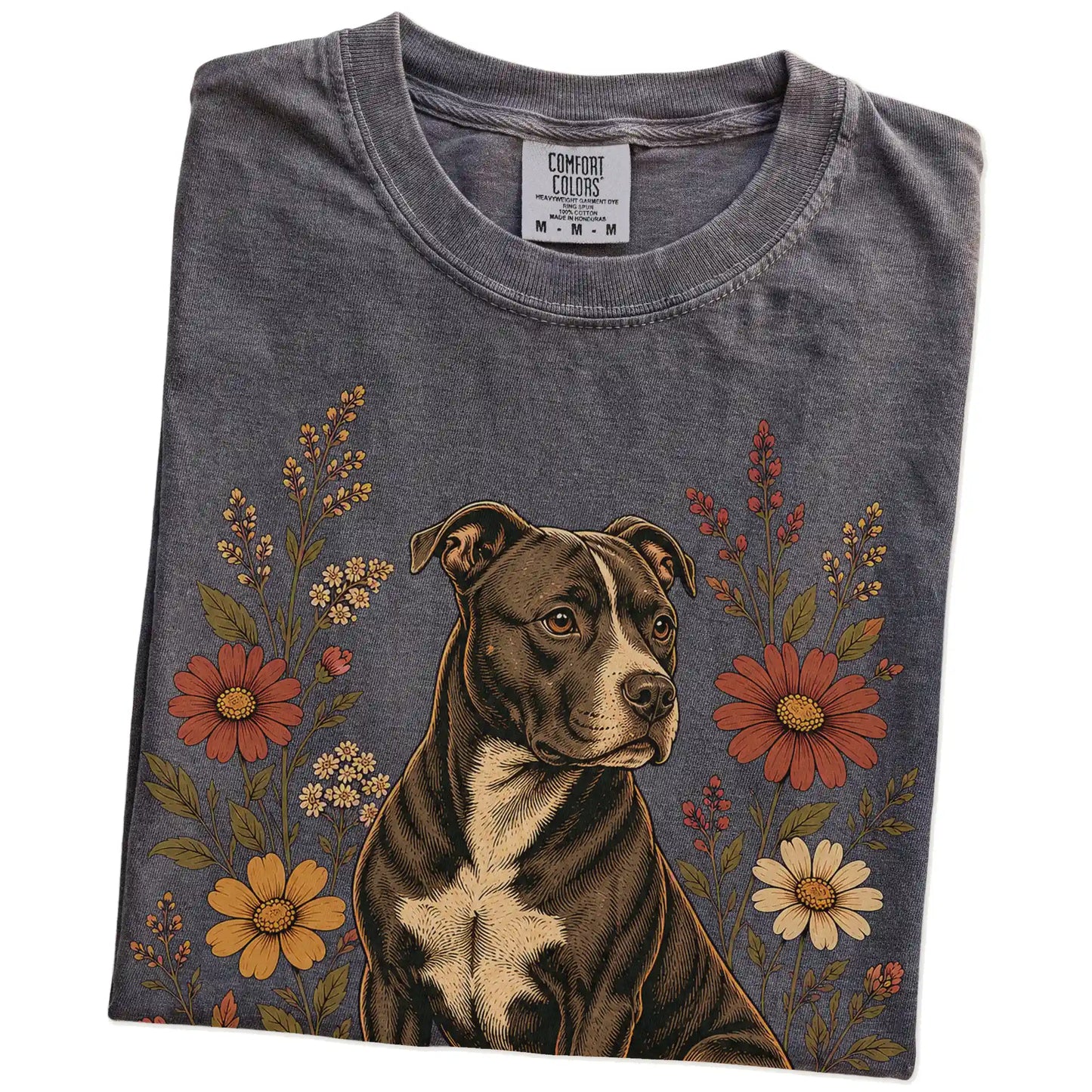 Folded Pepper Comfort Colors® T-shirt showing Pitbull portrait surrounded by wildflowers beneath the moon