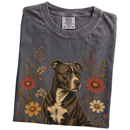 Folded Pepper Comfort Colors® T-shirt showing Pitbull portrait surrounded by wildflowers beneath the moon