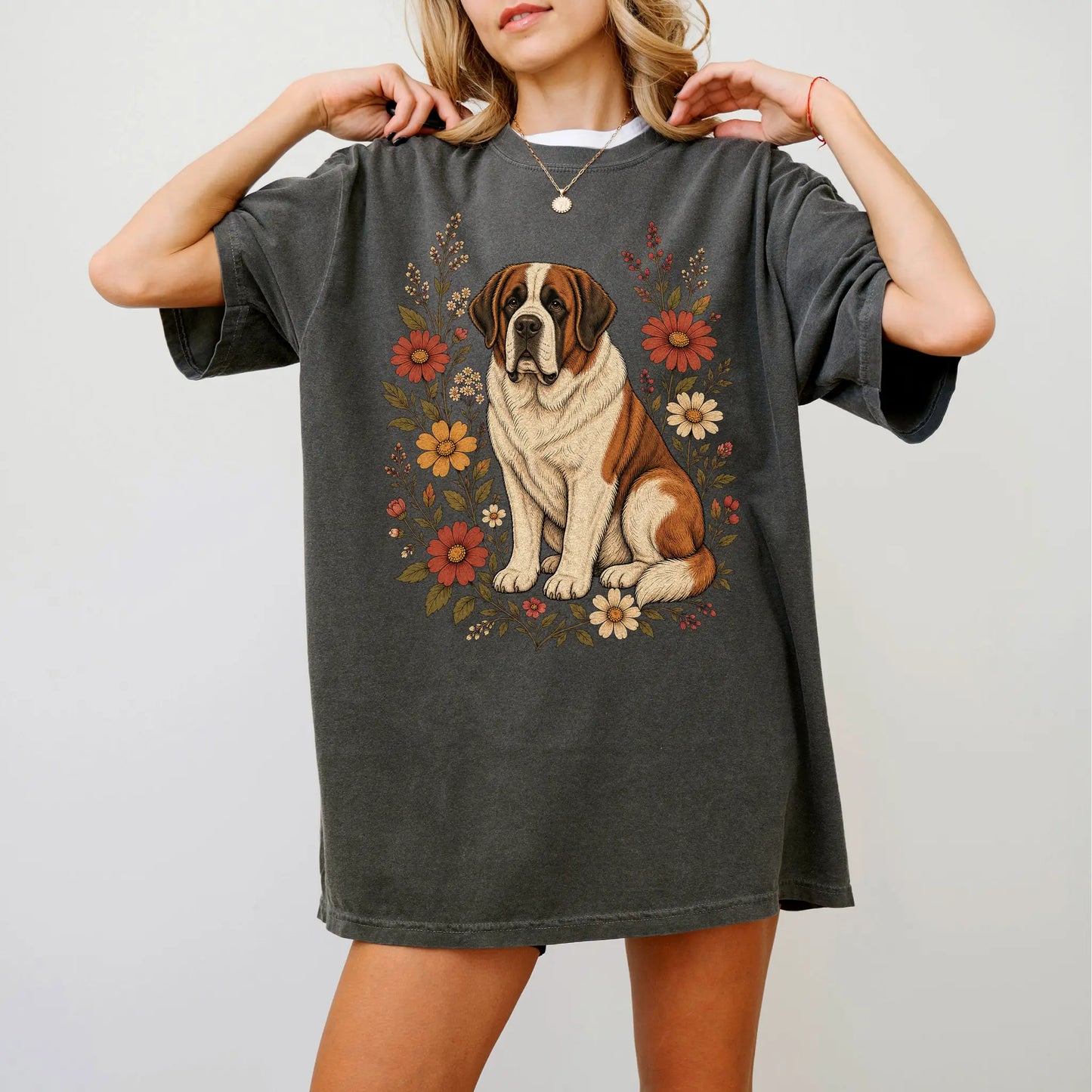 Model wearing a Pepper Comfort Colors® T-shirt showing Saint Bernard portrait surrounded by wildflowers beneath the moon
