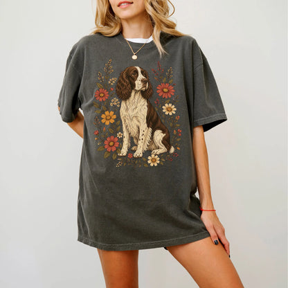 Model wearing a Pepper Comfort Colors® T-shirt showing Springer Spaniel portrait surrounded by wildflowers beneath the moon