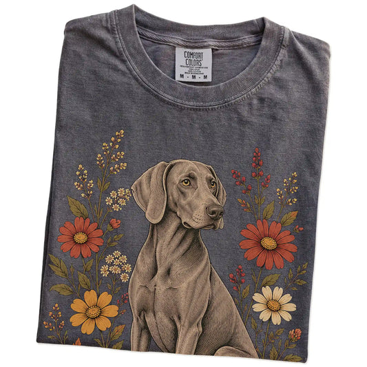 Folded Pepper Comfort Colors® T-shirt showing Weimaraner portrait surrounded by wildflowers beneath the moon