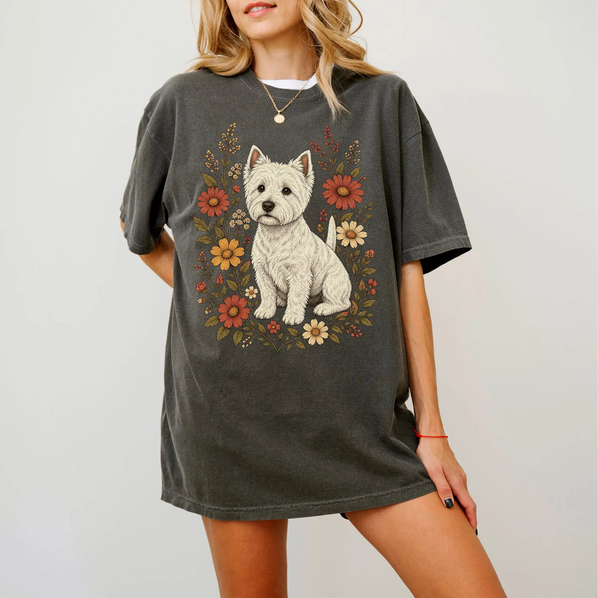 Model wearing a Pepper Comfort Colors® T-shirt showing Westie portrait surrounded by wildflowers beneath the moon