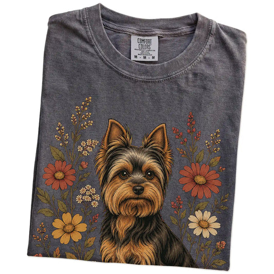 Folded Pepper Comfort Colors® T-shirt showing Yorkie portrait surrounded by wildflowers beneath the moon