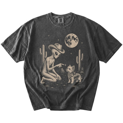 Cowboy alien fist-bumping a Yorkie beneath the moon on a Pepper Comfort Colors® T-shirt